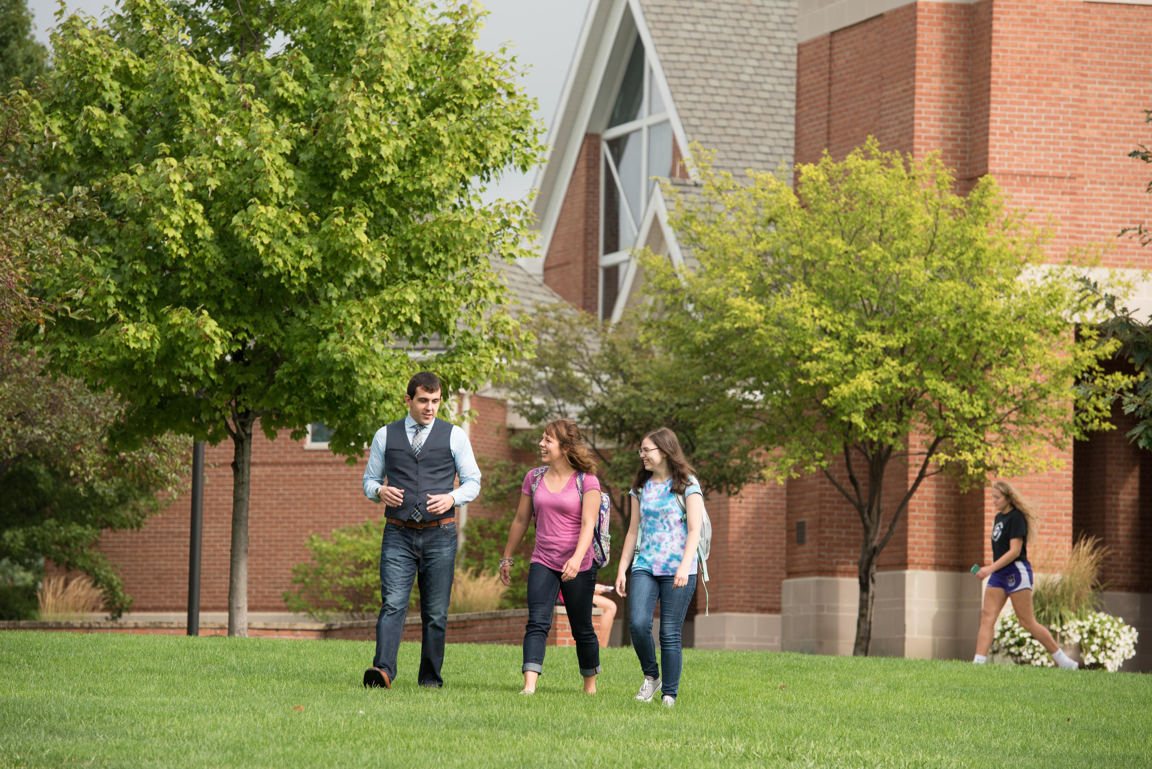 professor walking with students 